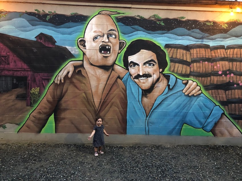 My daughter Ariana posing with Tom Selleck and Sloth at Burial Brewing Co. in Asheville, NC
